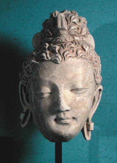Head of a Smiling Buddha, Greco-Buddhist style, from Hadda de Afghan School