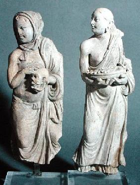 Two statuettes of standing monks, from Hadda