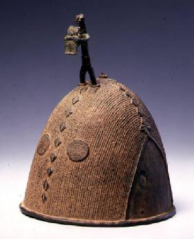 Helmet surmounted by a figure, Koma-Builsa, Ghana