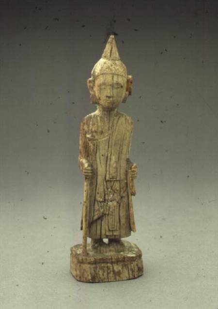 Ivory figure of the Penitent Buddha, walking and holding a staff,Burmese de Anonymous