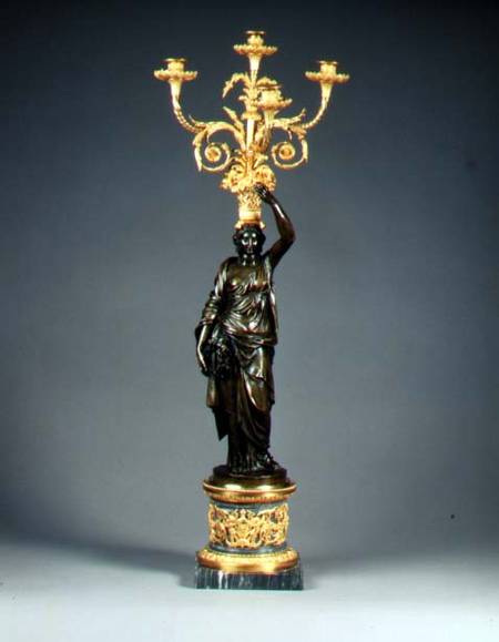 Louis XVI four-light candelabraormolu branches rising from a basket balanced on the head of a patina de Anonymous