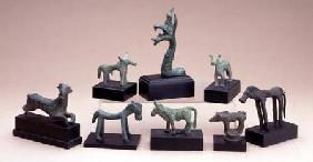 Collection of Greek bronze animals including a boara griffin and a running deer