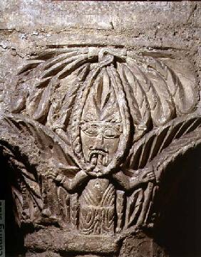 Column capital with carved decoration of a male figurefrom the crypt