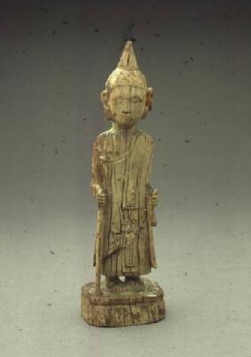 Ivory figure of the Penitent Buddha, walking and holding a staff,Burmese
