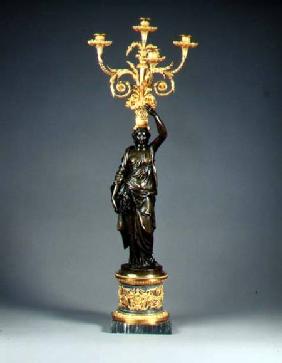 Louis XVI four-light candelabraormolu branches rising from a basket balanced on the head of a patina