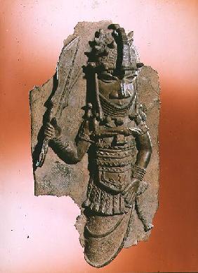Plaque depicting the royal god Oba holding the eben sword in his right hand, dancing to honour his a