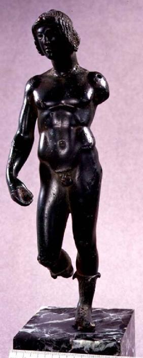 Statuette of a nude male wearing boots, possibly Dionysus, from Argive,Greek