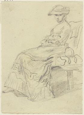 Sitzende Frau mit Gartenhut