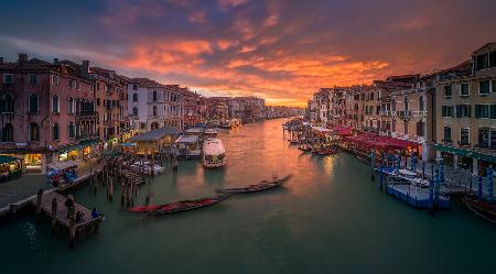 Grand Canal at sunset , view from the Rialto bridge , Venice .