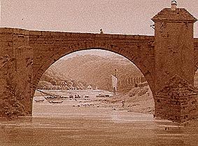 Puente de piedra sobre el río de Caspar David Friedrich