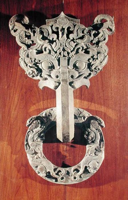 'P'u shou' door knocker with a taotie design surmounted by a phoenix and holding a ring with sculpte de Chinese School