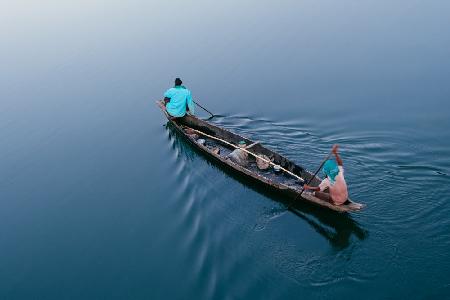 Men Rowing A Boat