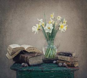 Still life with daffodils, old books and snails