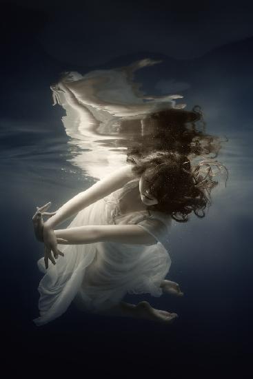 Girl in the dress under the water