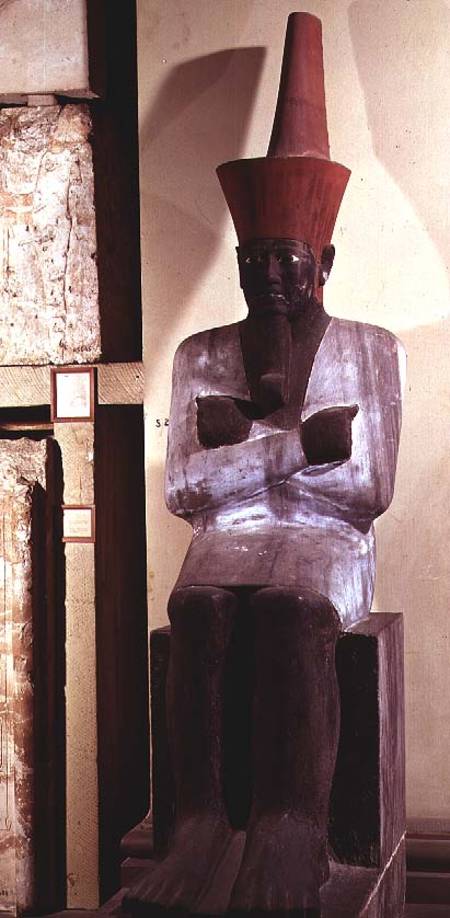 Statue of Mentuhotep II, enthroned and wearing the red crown of Lower Egypt, taken from the Mortuary de Egyptian