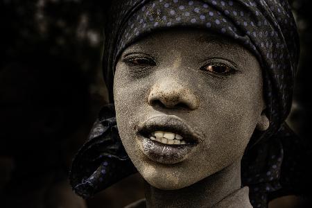 mundari boy covered by ashes