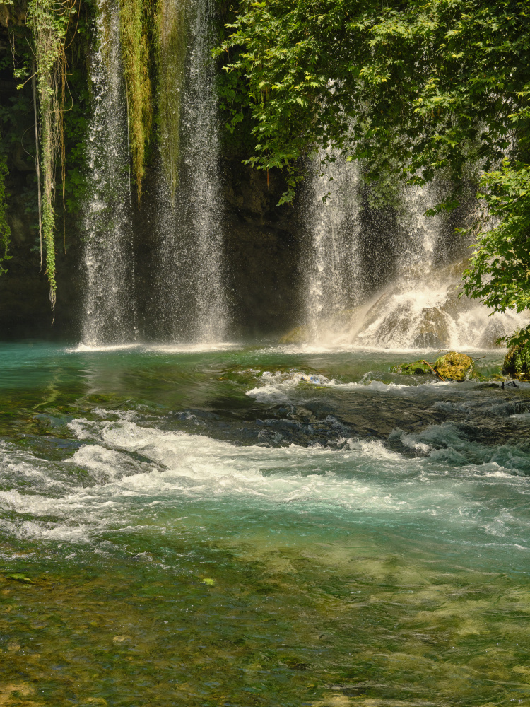 beautiful waterfall in the forest de engin akyurt