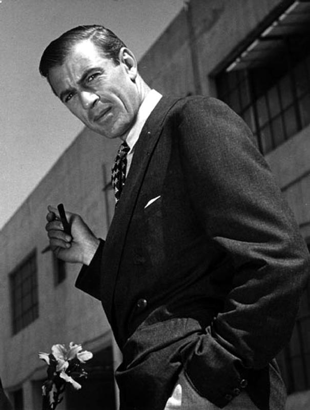 American Actor Gary Cooper smoking a pipe de English Photographer, (20th century)