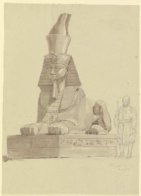 Ägyptische Sphinx in Alexandria, daneben ein Ägypter in traditioneller Tracht