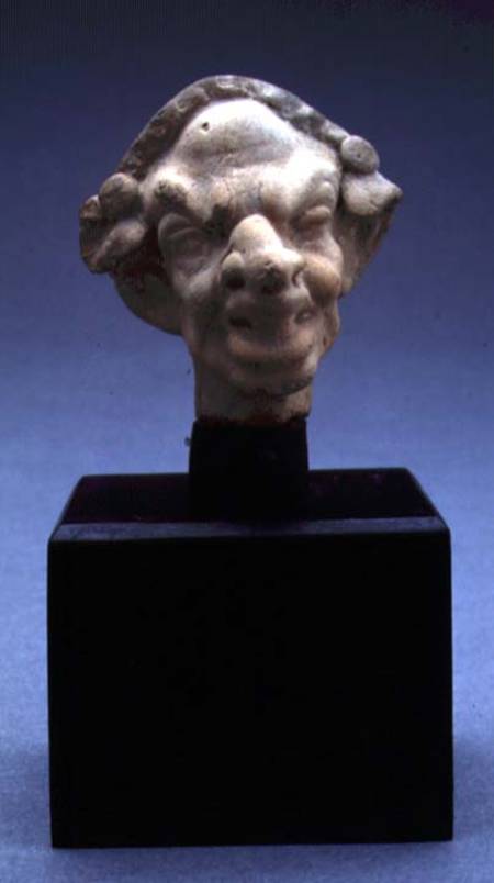 Grotesque head of a woman de Greek