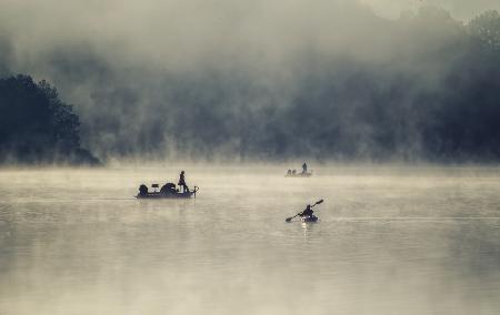 Boating in the misty lake