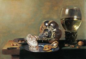 A still life with glass of wine, tazza and a pewter plate