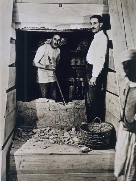 Howard Carter (1873-1939) and a colleague standing beside a partially demolished wall to one of the  de Harry Burton