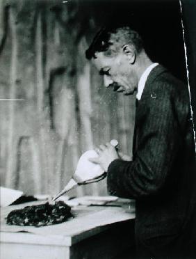 Mr Mace, Associate Curator of the Metropolitan Museum of Art, New York, treating one of the objects 