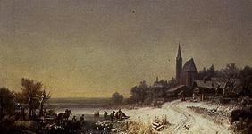 Wintry village with church at a lake
