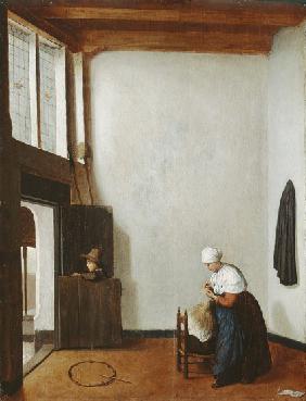 Interior with a woman combing a little girl's hair