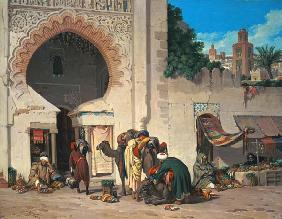 Escena de una calle con árabes y camellos