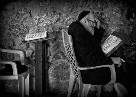 Reading a holy book (Jerusalem, Israel).