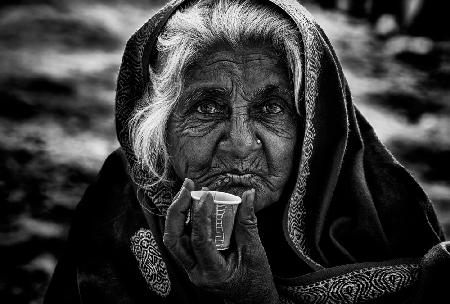 Indian woman taking chai.