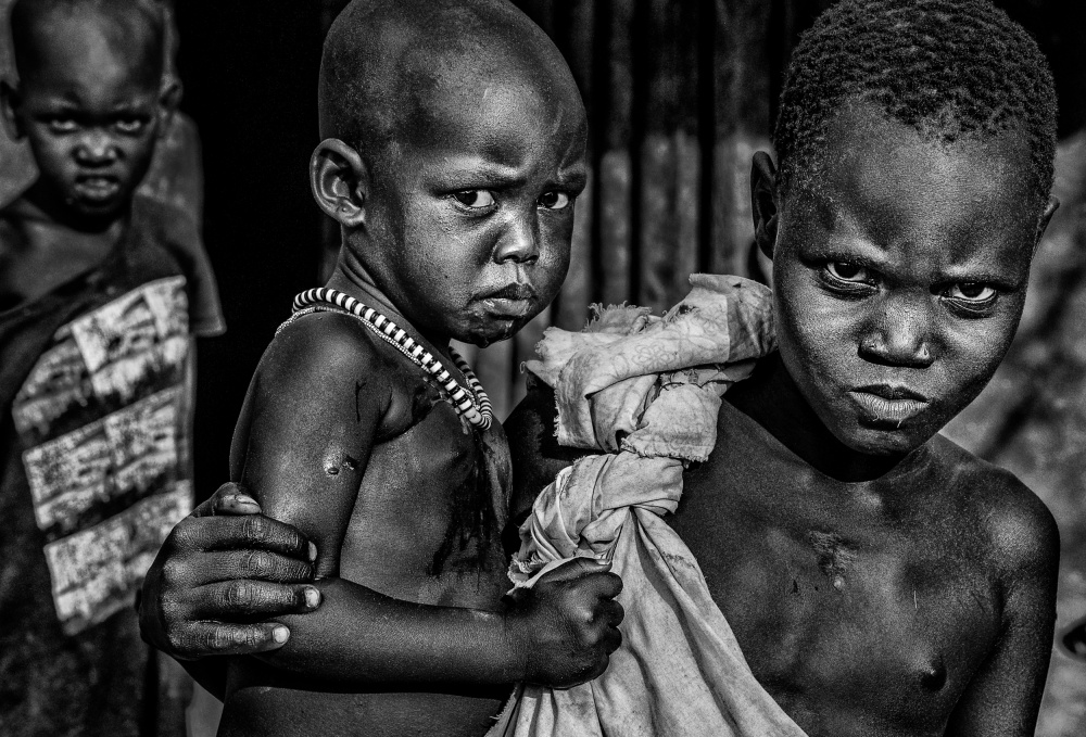 South Sudanian children showing angry expression. de Joxe Inazio Kuesta Garmendia