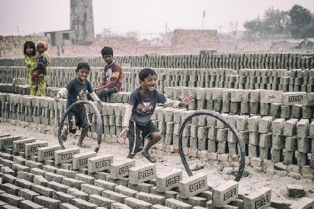 Children games at brickyard in Dhaka