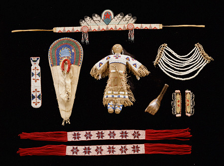 A Collection Of Objects Including Plains Beaded Necktie,  Model Cradleboard, Doll And Neck Ornament de 