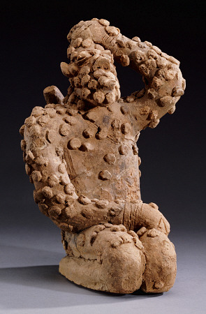 A Djenne Terracotta Kneeling Male Figure, 14th Century de 