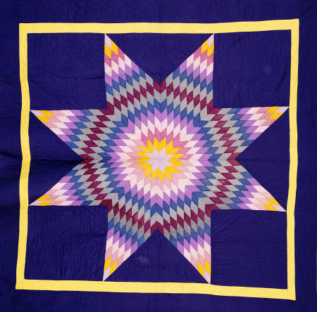 An Amish Pieced & Quilted Cotton Coverlet Worked In A Multicolored Lone Star On A Navy Background de 