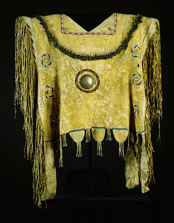 An Apache Beaded And Fringed Buckskin Poncho, Painted With Yelloe Ochre And Decorated With Tin Cones de 