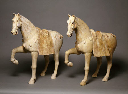 A Pair Of Buff Pottery Figures Of Prancing Caparisoned Horses de 