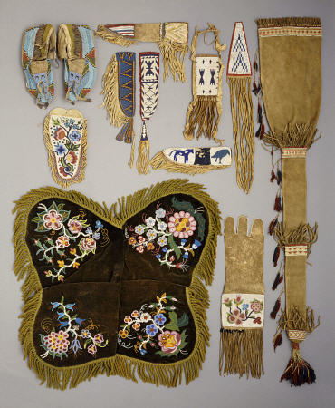 A Selection Of Native American Artefacts Including A Pair Of Sioux Beaded Moccasins And Skin Mirror de 