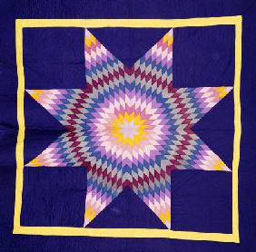 An Amish Pieced & Quilted Cotton Coverlet Worked In A Multicolored Lone Star On A Navy Background