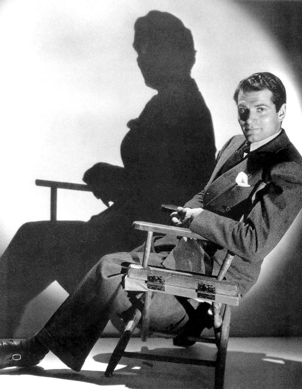 English Actor Laurence Olivier seated on a chair's director de 
