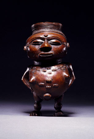 Face On View Of A Wongo Cup Carved As A Female Standing Figure With Spherical Body de 