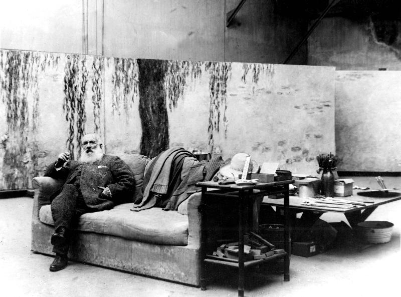 French painter Claude Monet in his workshop in front of one of his paintings Waterlilies de 