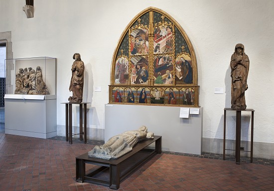 Interior of the gallery with an altarpiece and sculptures de 