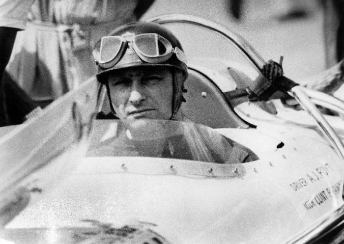 racing driver Fangio here at the wheel during race in Monza de 