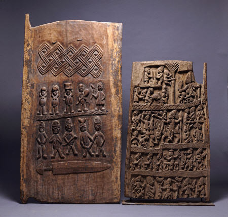 Two Yoruba Doors, One For A Shango Shrine, Both Carved In Relief With Various Figures de 