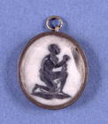 Wedgwood Jasper Medallion mounted in an oval pendant, depicting a slave and the inscription 'Am I No