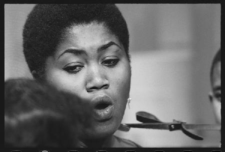 Odetta sings to childern on set of a TV special